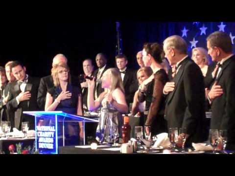 BreAnn, with her dad and mom, singing National Anthem at the National Charity Dinner.