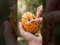 A spiky golden dragon egg with a neon green heart! 🛸🔥💚 #asmr #oddlysatisfying #viral #eating #fruit