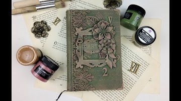 altered book cover with finnabair rust effect pastes