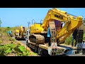 Excavator Transport To The Road Construction Site By Fuso Self Loader Trucks Komatsu PC200 Kobelco