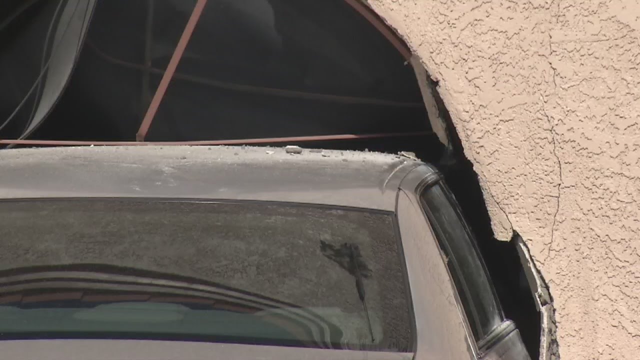 Car crashes into building - YouTube