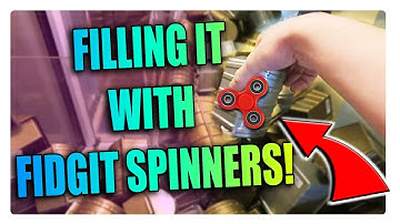 FILLING CLAW MACHINES WITH FIDGET SPINNERS!!