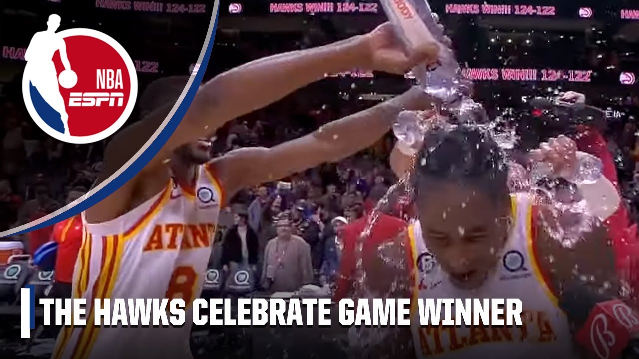 The Hawks DOUSE AJ Griffin in water after his game winner 🌊