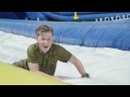 Robert  chandler test out australia zoos waterslide for summer down under