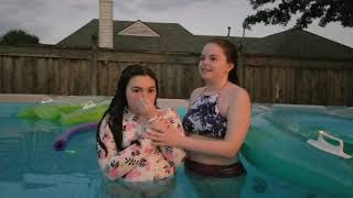 My youngest Daughter being baptized by my older daughter in our pool during Quarantine