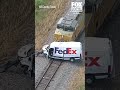Train hits FedEx truck in Texas