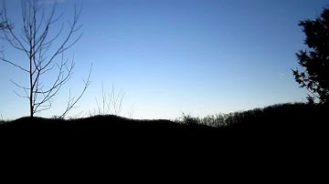 Time Lapse  - Early Morning Airplane Contrails Over The Mountains