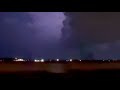 Storm chasers shock as lightning flash suddenly illuminates unseen tornado