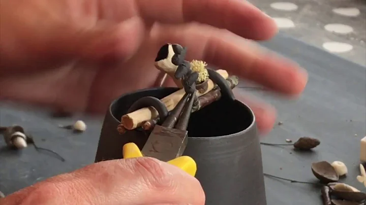 Elaine Bolt   adding pieces to a Woodland Vessel