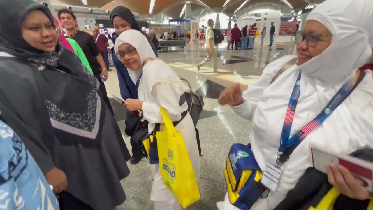 Mak andak and Mak uda proceeding to the gate for departure 2026