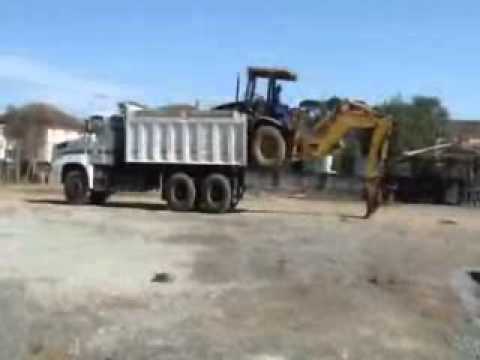 backhoe in dumptruck
