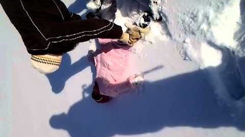 Maya and ima making snow angles - 12.30.12