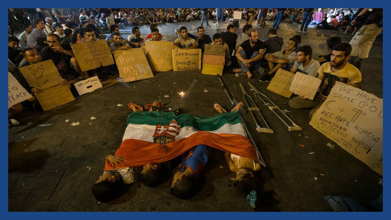 Film backdrop image for Refugee crisis in Hungary: how thousands spend the night at Keleti station (2015)