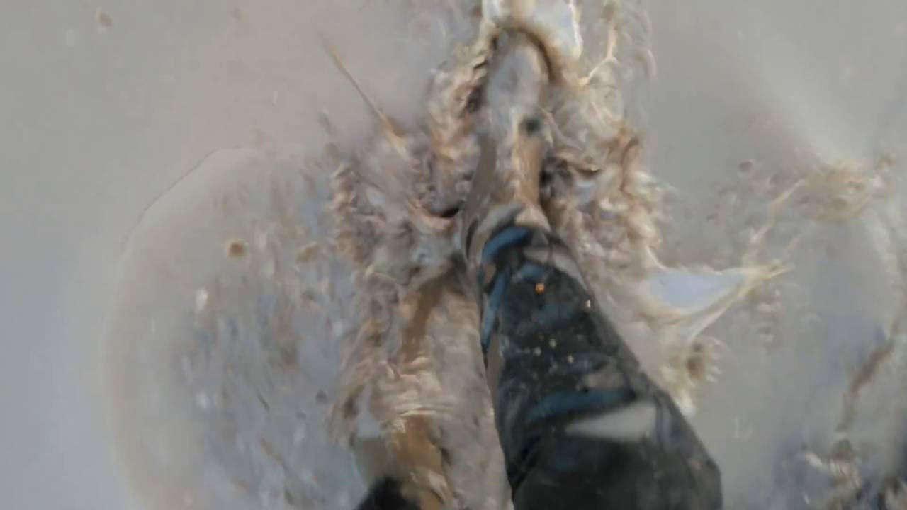 Old Overknee boots in mud