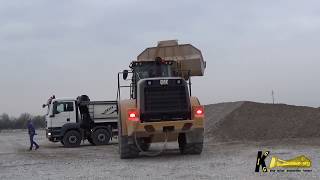 Caterpillar 972M Wheel Loader Loading Man and Scania Trucks.