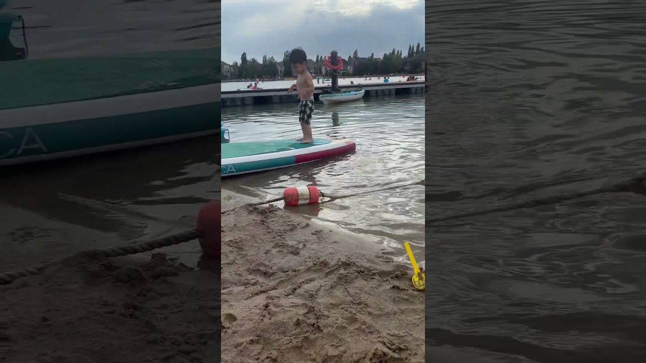 Toddler playing at the beach in Auburn Bay 