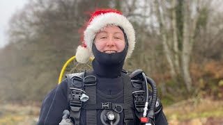 Female Diver In Drysuit Dives With Pollock In Scottish Sea Loch