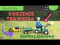 Koszenie trawy kosiarką spalinową. Deutz-Fahr w akcji. Ładowanie skoszonej trawy na przyczepę.