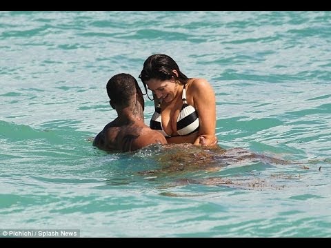 Kelly Brook in the sea in black and white striped bikini with boyfriend David McIntosh