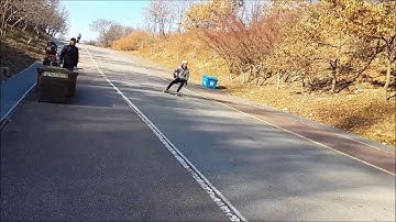 Longboarding:Toe side stand up power slide & Corn