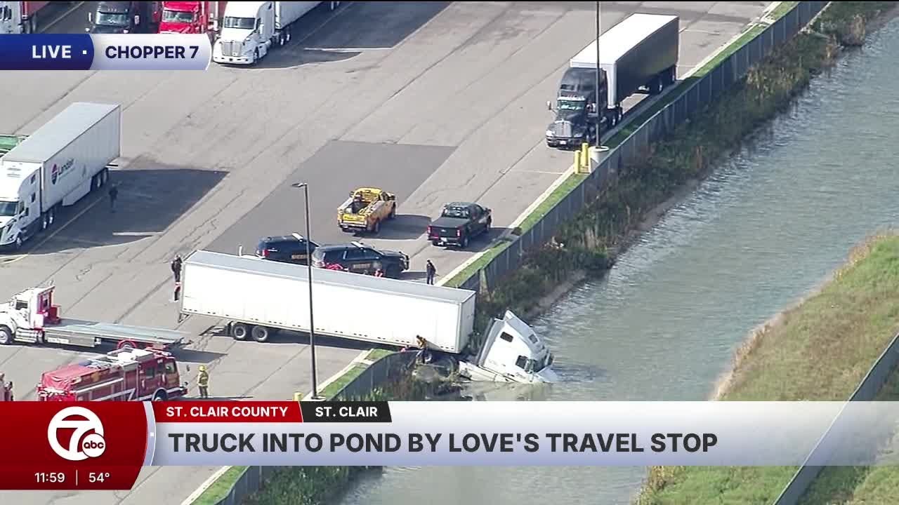 Truck into pond by Love's travel stop