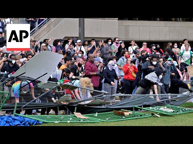 Pro-Palestinian protesters knock down barrier at MIT