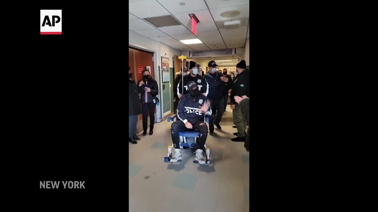 NYPD officer shot in the Bronx leaves hospital - YouTube