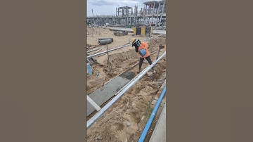Technical workers cast lean concrete of ground beam