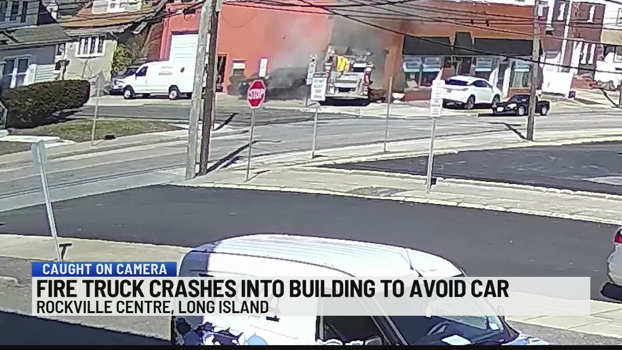Fire truck crashes into building to avoid car - YouTube