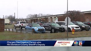 Driver charged after Davidson County deputy hit by car while directing traffic near elementary sc...