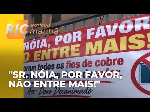 Businessman displays banner asking thieves to stop breaking into and robbing building in Curitiba.