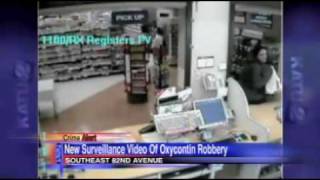 Tall female Oxycontin robbery suspect caught on video