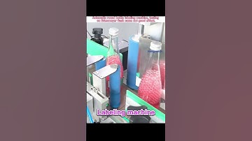 Automatic erlenmeyer flask labeling machine, it’s also suitable for round bottles, tubes, tin cans