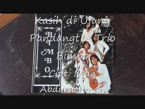 Free Download Kasih Di Ujung Pandang ( Iwan Abdurachman ) - Trio Bimbo Mp3 dan Mp4