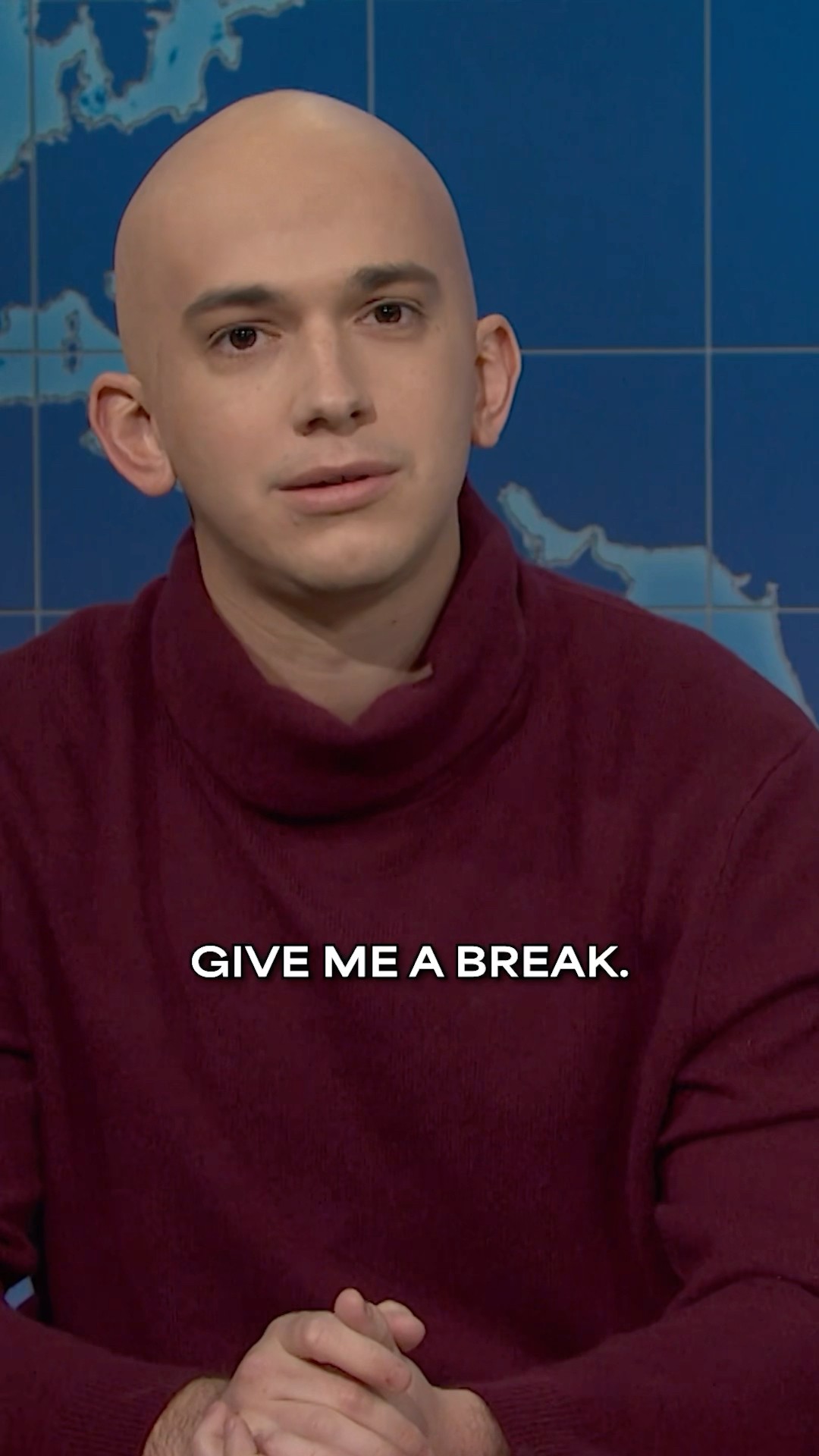 a bald man stops by the desk