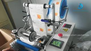 Semi automatic tabletop juice empty plastic bottle labeling machine round bottle rolling labeler