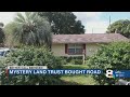 Mysterious land trust behind backyard property dispute once bought a private, dead-end road