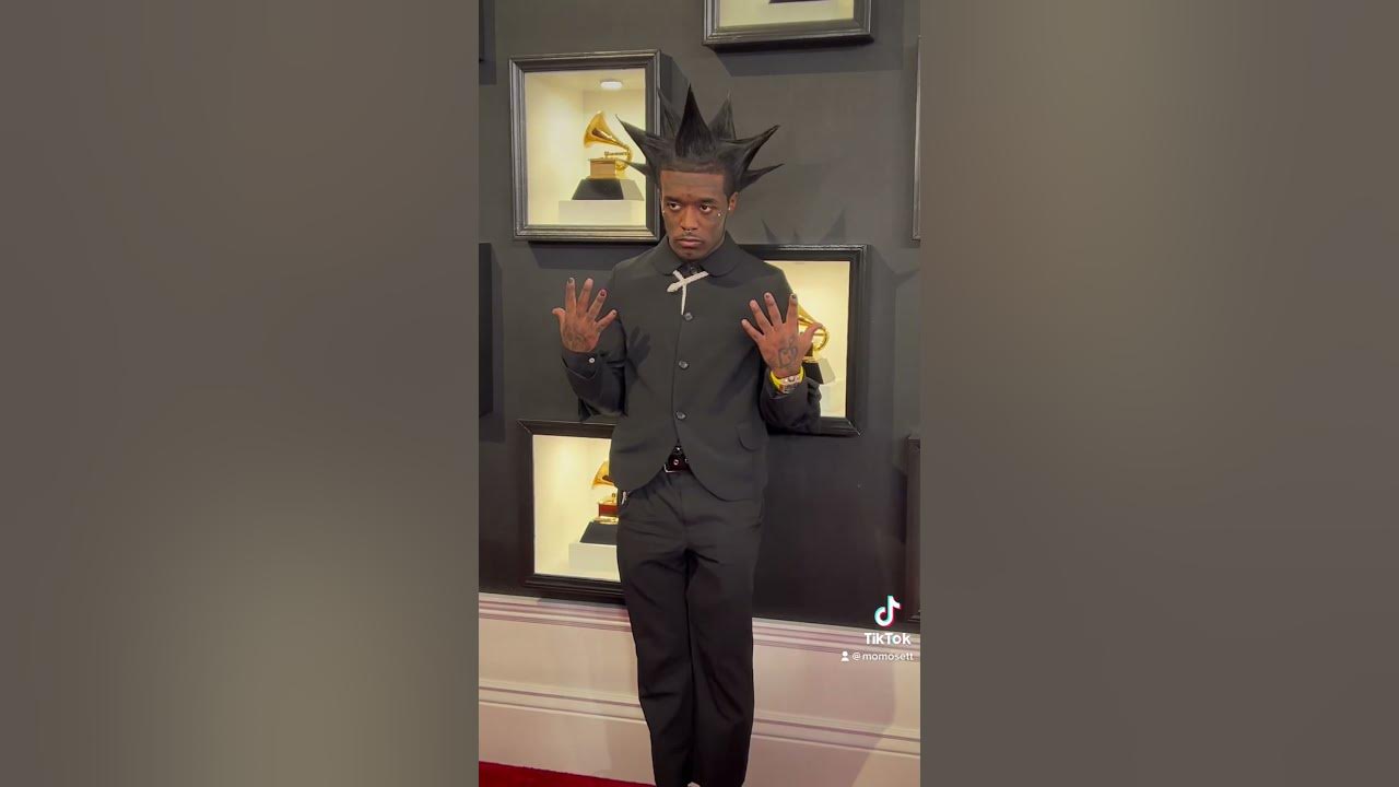 Lil Uzi Vert posing on the GRAMMYs red carpet YouTube