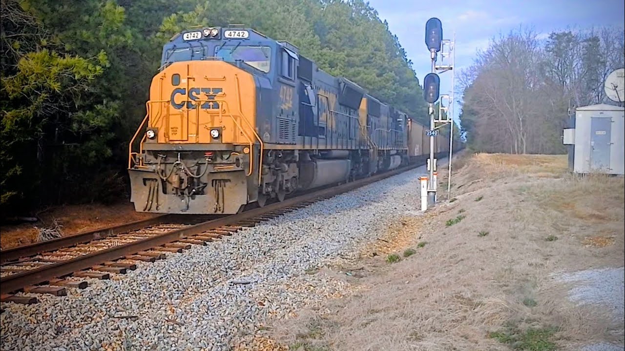 CSX E319 with double SD70MAC and CE&I Heritage unit at Chester SC on the CSX Monroe Subdivision 