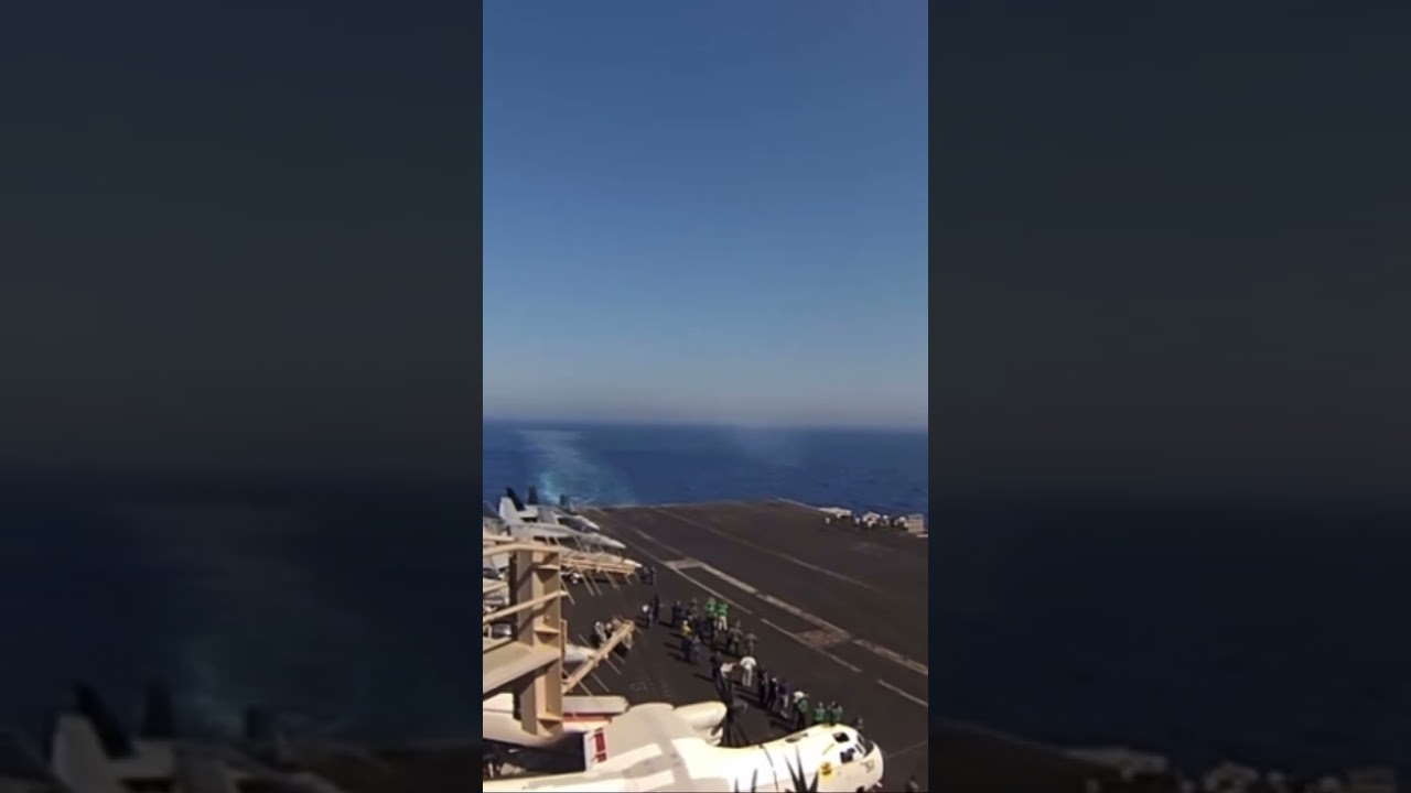 F/A 18 Breaking the sound barrier passing a aircraft carrier!!! 