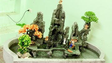 creating porous rock and cement rockery imitating miniature rocky mountains with waterfalls