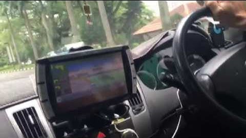A Comfort taxi driver showing how alerts are given through his mobile display terminal