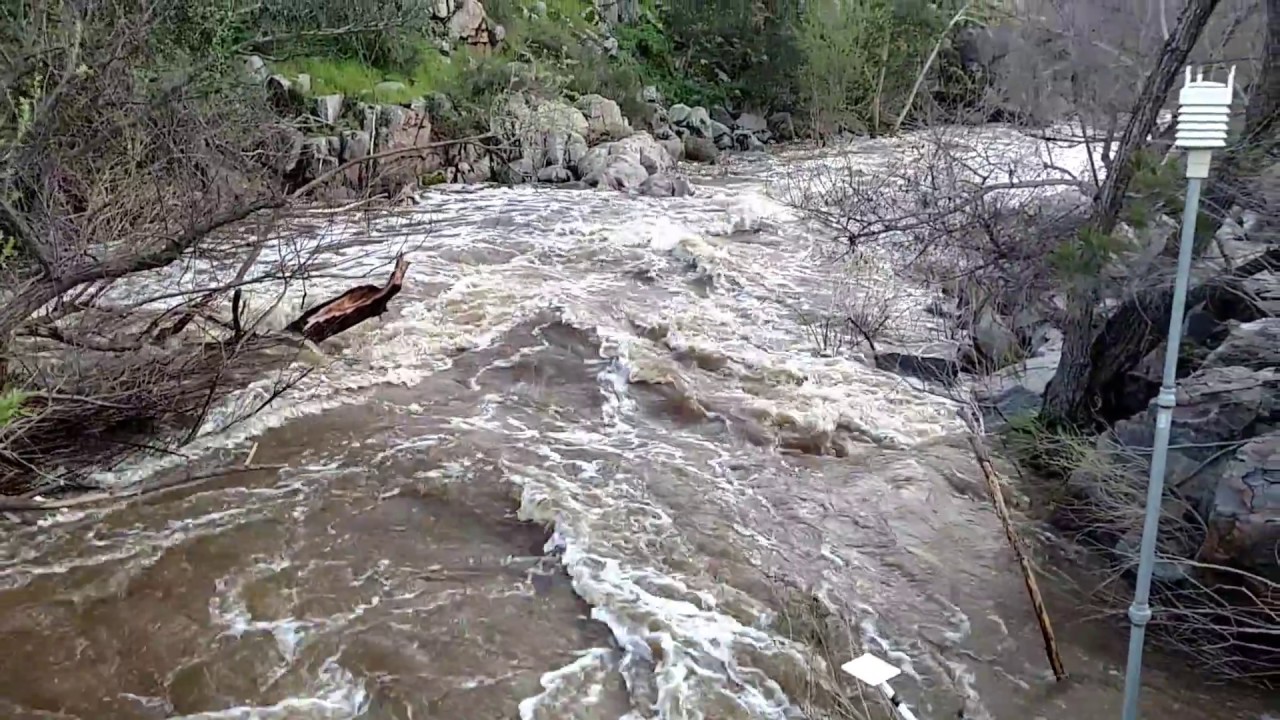 San Diego River in flood stage - view from MTRP pedestrian bridge - YouTube