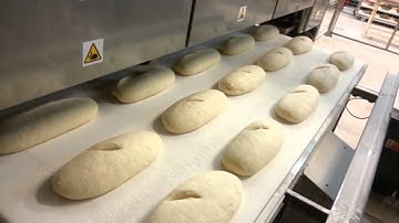 Kornfeil - Automatic bread scoring for deck oven line.
