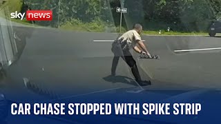 US: Police officer stops car chase by bursting suspect's tyres with spike strip
