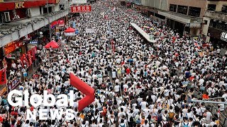 Timelapse footage filmed from a high-rise building captured several
hundreds of thousand protesters who gathered in hong kong streets to
rally against prop...