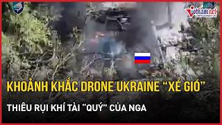 The moment a Ukrainian drone tears through the air to torch high-value Russian military hardwar...