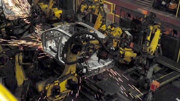 Car Factory production line - robots welding bodies