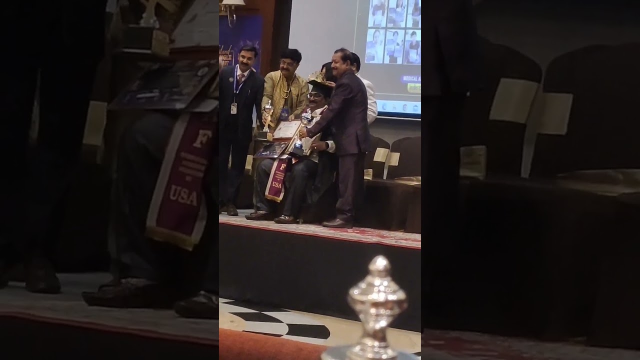 receiving doctrate award by IAF USA.