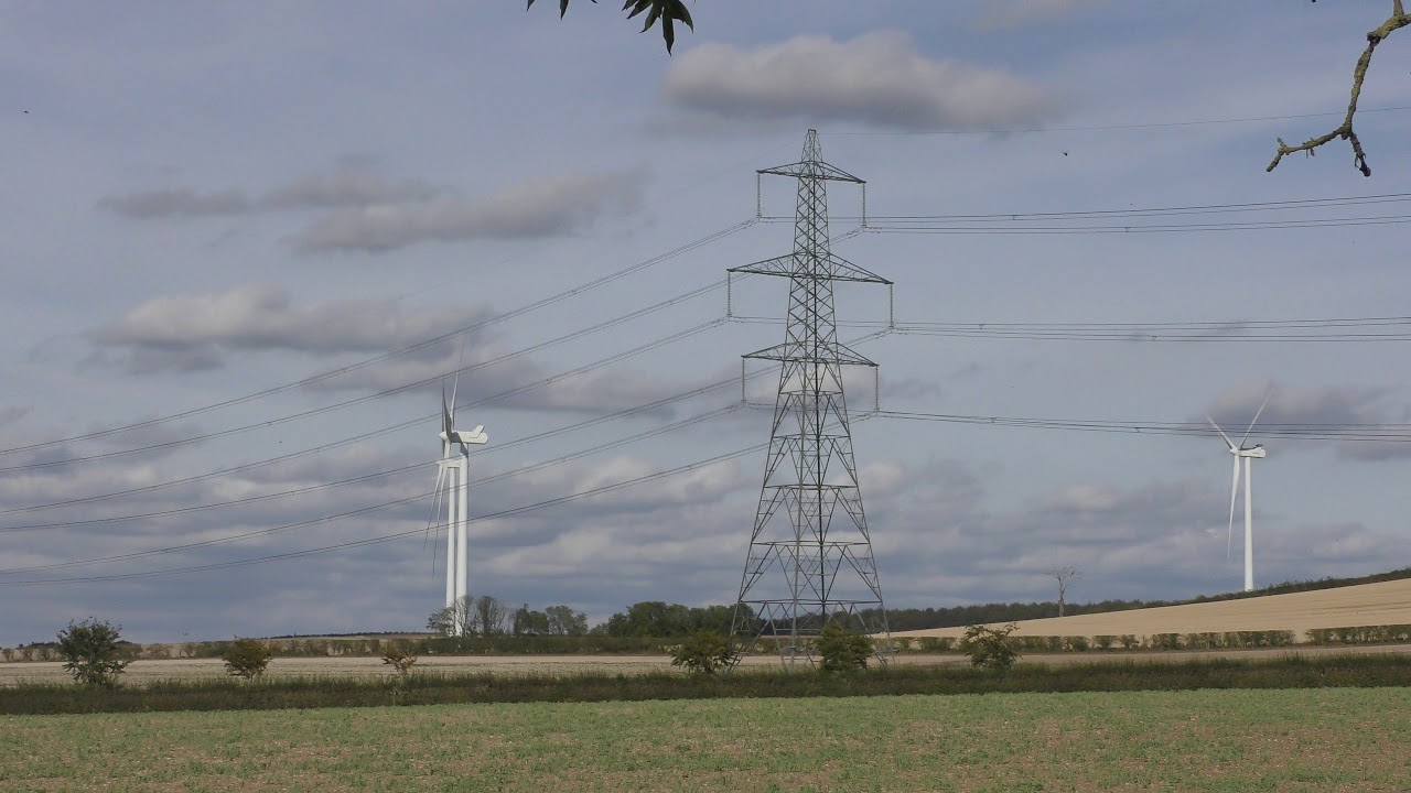 walking pez Electricity Pylon surrounded by Wind turbines Balsham Wind farm Historic Earthworks 15sep19 408p